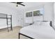 Bedroom featuring bunkbeds with a modern bathroom nearby at 1921 Fern Ave, Sarasota, FL 34235