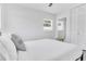 Calm bedroom with white walls, stool, and wardrobe at 1921 Fern Ave, Sarasota, FL 34235
