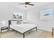 Cozy bedroom with two windows and minimal bedside tables at 1921 Fern Ave, Sarasota, FL 34235