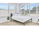 Bedroom featuring light wood floors and a bright sunny view through a large window at 1921 Fern Ave, Sarasota, FL 34235