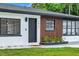 Close up of the exterior showcasing the freshly painted trim and wood siding at 1921 Fern Ave, Sarasota, FL 34235