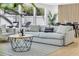 Comfortable living area with ample seating, stylish rug, and modern wood slat accent wall at 1921 Fern Ave, Sarasota, FL 34235