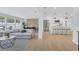 Open concept living space with kitchen, dining area, and living room with modern decor at 1921 Fern Ave, Sarasota, FL 34235