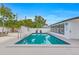 Inviting pool area surrounded by lounge chairs and lush landscaping at 1921 Fern Ave, Sarasota, FL 34235
