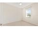 Bright bedroom featuring neutral walls, tile floors, ceiling fan and a sunlit window at 19798 Cobblestone Cir, Venice, FL 34292