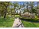 Entrance to Stonewalk community features a lushly landscaped sign at 19798 Cobblestone Cir, Venice, FL 34292