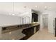 Spacious kitchen featuring granite countertops, stainless steel appliances, and a breakfast bar at 19798 Cobblestone Cir, Venice, FL 34292