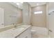 Well-lit bathroom featuring a shower-over-tub, granite counter, and ample space at 2290 Beeville Ave, North Port, FL 34286