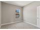 Cozy bedroom with neutral tones and plush carpeting, offering a serene atmosphere at 2290 Beeville Ave, North Port, FL 34286