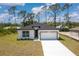 Charming single-story home with a two-car garage and well-manicured lawn at 2290 Beeville Ave, North Port, FL 34286