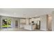 Open kitchen with stainless steel appliances and a center island at 2290 Beeville Ave, North Port, FL 34286