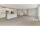 A modern kitchen with stainless steel appliances, an island, and wood floors at 2290 Beeville Ave, North Port, FL 34286