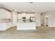 Open kitchen with granite counters, stainless appliances, tile backsplash, and an island at 2290 Beeville Ave, North Port, FL 34286