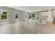 Spacious living area features lots of natural light and access to a kitchen at 2290 Beeville Ave, North Port, FL 34286