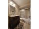 Cozy bathroom featuring an updated vanity sink and tiled shower at 2300 Stickney Point Rd # 125, Sarasota, FL 34231