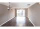 Spacious open concept living area with lots of natural light, a ceiling fan, and direct access to an outdoor balcony at 2300 Stickney Point Rd # 125, Sarasota, FL 34231