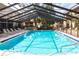 Inviting community pool with clear blue water and plenty of lounge chairs at 2300 Stickney Point Rd # 125, Sarasota, FL 34231