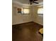 Cozy bedroom featuring a ceiling fan and light colored curtains at 2503 23Rd W Ave, Bradenton, FL 34205