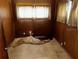 A bedroom featuring wood paneling and a window with curtains at 2503 23Rd W Ave, Bradenton, FL 34205