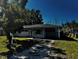 Exterior of the home, showing its facade, front yard, and driveway at 2503 23Rd W Ave, Bradenton, FL 34205