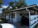The exterior of the home features a carport and a white exterior at 2503 23Rd W Ave, Bradenton, FL 34205