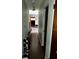 Hallway leading to living room featuring modern gray flooring at 2503 23Rd W Ave, Bradenton, FL 34205