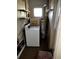 Practical laundry room with white washing machine and water heater at 2503 23Rd W Ave, Bradenton, FL 34205