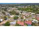 Aerial view of the neighborhood with a lake in the distance at 2536 Carlisle Pl, Sarasota, FL 34231