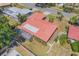 Aerial view of the red tile roof, screened-in lanai, and fenced-in backyard at 2536 Carlisle Pl, Sarasota, FL 34231