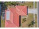 Aerial view of the red tile roof, driveway, and landscaping at 2536 Carlisle Pl, Sarasota, FL 34231