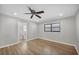 Cozy bedroom features tile flooring, ceiling fan and an en suite bathroom at 2536 Carlisle Pl, Sarasota, FL 34231