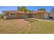 Quaint one-story home with a colorful tile roof, white trim, and freshly cut lawn at 2536 Carlisle Pl, Sarasota, FL 34231