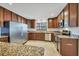 Contemporary kitchen featuring stainless steel appliances, custom cabinets, and granite counters at 2536 Carlisle Pl, Sarasota, FL 34231