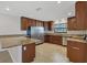 Modern kitchen featuring granite countertops, stainless steel appliances, and custom cabinetry at 2536 Carlisle Pl, Sarasota, FL 34231
