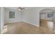Large living area with tile floors, archways, and natural light at 2536 Carlisle Pl, Sarasota, FL 34231