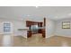 Open living area with a kitchen, bar and tile floors throughout at 2536 Carlisle Pl, Sarasota, FL 34231