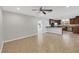 Open-concept layout with seamless flow between living area, kitchen, and tiled flooring at 2536 Carlisle Pl, Sarasota, FL 34231