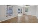 Bright, airy living room with tile flooring and sliding glass door at 2536 Carlisle Pl, Sarasota, FL 34231