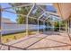 Spacious screened-in patio with brick flooring, ideal for outdoor entertaining at 2536 Carlisle Pl, Sarasota, FL 34231