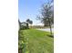 Expansive backyard featuring a peaceful pond view at 256 Van Gogh Cv, Bradenton, FL 34212