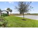 Lush backyard featuring a tranquil pond setting at 256 Van Gogh Cv, Bradenton, FL 34212