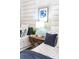 Cozy bedroom features twin beds with stylish bedding, a wooden nightstand, and coastal-inspired decor at 256 Van Gogh Cv, Bradenton, FL 34212