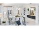 Bright open dining space featuring modern lighting, decor, and view into the kitchen at 256 Van Gogh Cv, Bradenton, FL 34212