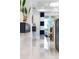 Hallway featuring sleek tile floors, contemporary decor, and bright, open space at 256 Van Gogh Cv, Bradenton, FL 34212
