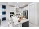 Modern kitchen with a large island, stainless steel appliances, and stylish pendant lighting at 256 Van Gogh Cv, Bradenton, FL 34212