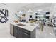 Bright kitchen with a central island, open to the dining and living areas, perfect for entertaining at 256 Van Gogh Cv, Bradenton, FL 34212
