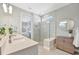 Bright bathroom with double vanity, glass enclosed shower, and modern fixtures at 27061 Paradise Shores Dr, Englewood, FL 34223
