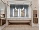 Modern bathroom features double sinks, large mirrors, and stylish countertops with tile flooring at 27061 Paradise Shores Dr, Englewood, FL 34223