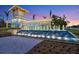 Elegant community entrance with a water feature and landscaping at 27061 Paradise Shores Dr, Englewood, FL 34223