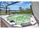 Hot tub on an outdoor patio overlooking a lake at 27061 Paradise Shores Dr, Englewood, FL 34223